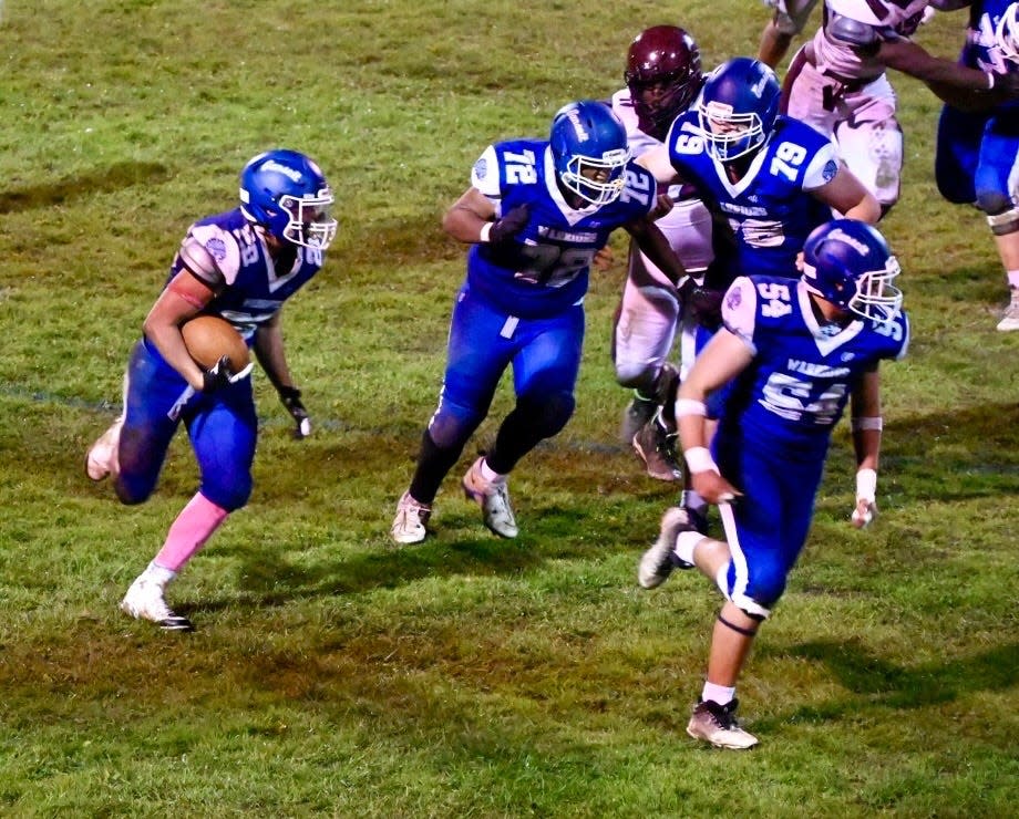 Narragansett’s Joey Pineyro (28) takes off on his 50-yard TD run early in the third quarter of a 42-14 win over Ayer-Shirley on Friday, October 13, 2023.