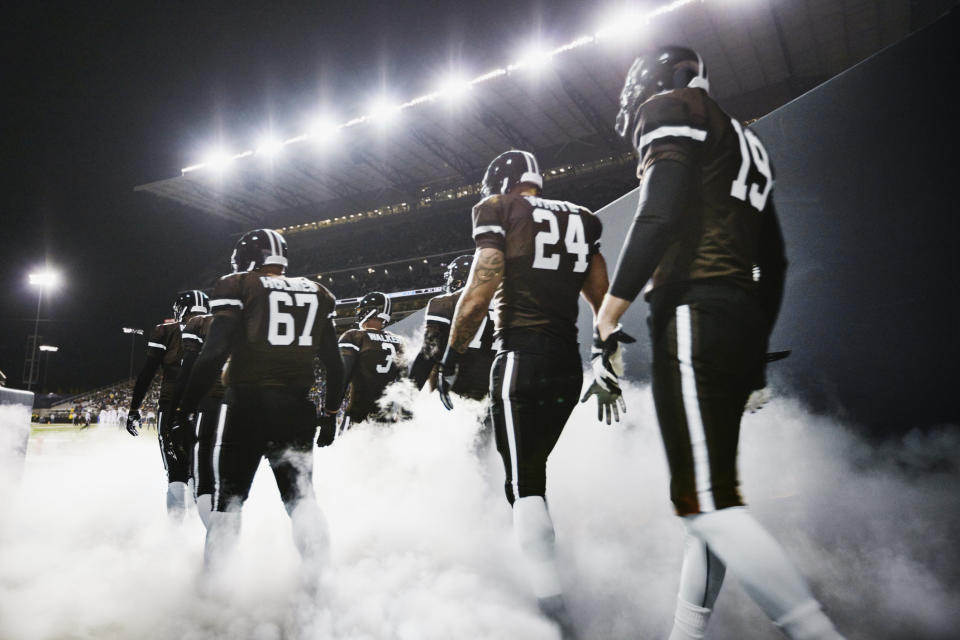 A football team entering the field