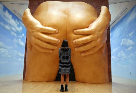 A gallery assistant poses amongst work by Anthea Hamilton from her nominated show "Lichen! Libido!(London!) Chastity!" at a preview of the Turner Prize in London, Britain September 26, 2016. REUTERS/Neil Hall