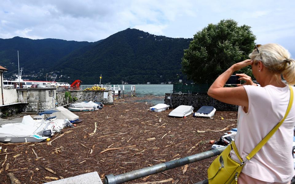 Trees and debris clog up the shores of Lake Como after heavy rain caused flooding - FLAVIO LO SCALZO /REUTERS