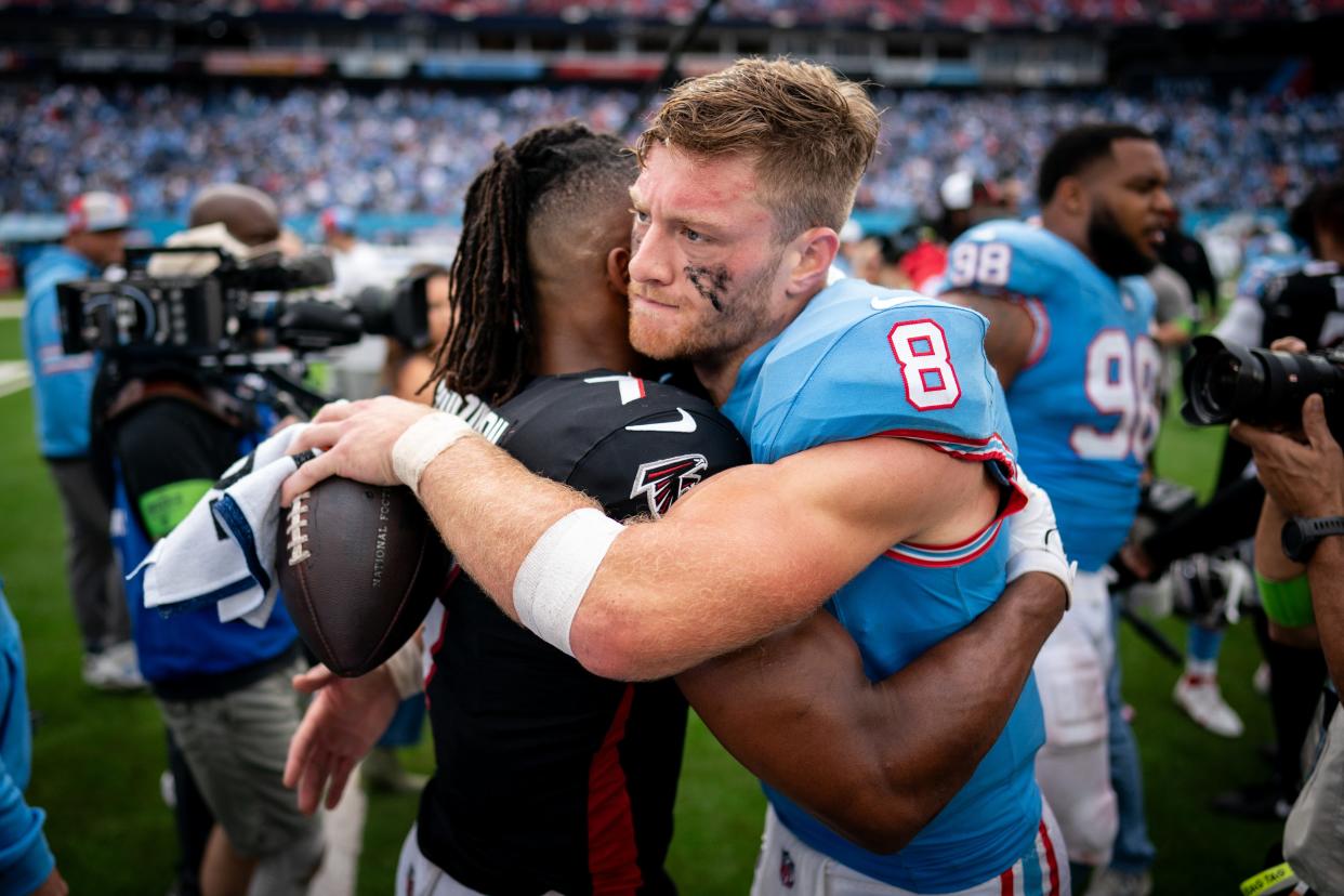 Tennessee Titans quarterback Will Levis (8) hugs Atlanta Falcons running back Bijan Robinson (7) after the Titans defeated the Falcons at Nissan Stadium in Nashville, Tenn., Sunday, Oct. 29, 2023.