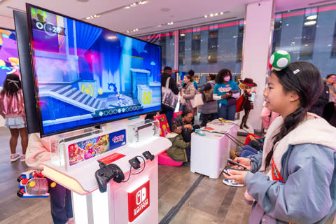 In this photo provided by Nintendo of America, Madison C., 12, plays as Swordfighter Peach to celebrate the game's release of ``Princess Peach: Showtime!'' at the Nintendo New York Store in Rockefeller Center.