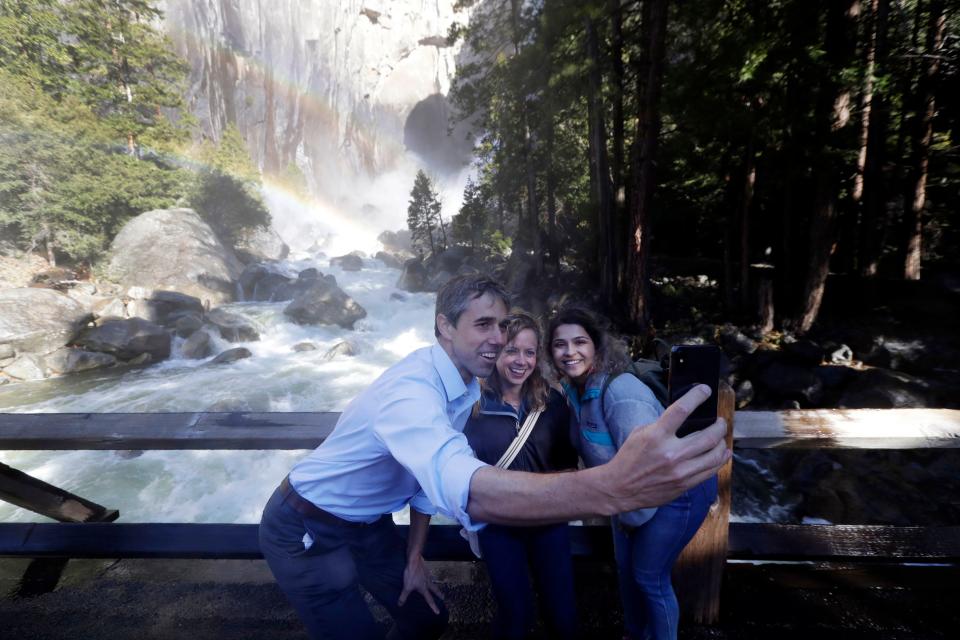 In a Monday, April 29, 2019 file photo, Democratic presidential candidate and former Texas congressman Beto O'Rourke, left, takes a selfie with Anne Kelly, center, Director of the Sierra Nevada Research Stations and environmental advocate Leslie Martinez, in Yosemite National Park, Calif.