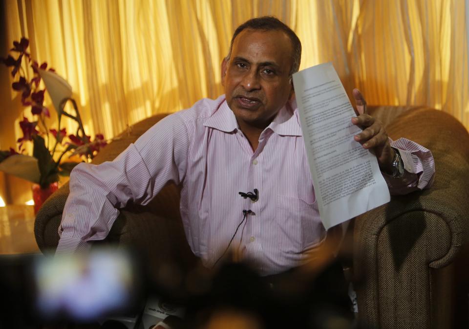 Uttam Khobragade, father of Devyani Khobragade, India's deputy consul general in New York, speaks during a news conference in Mumbai