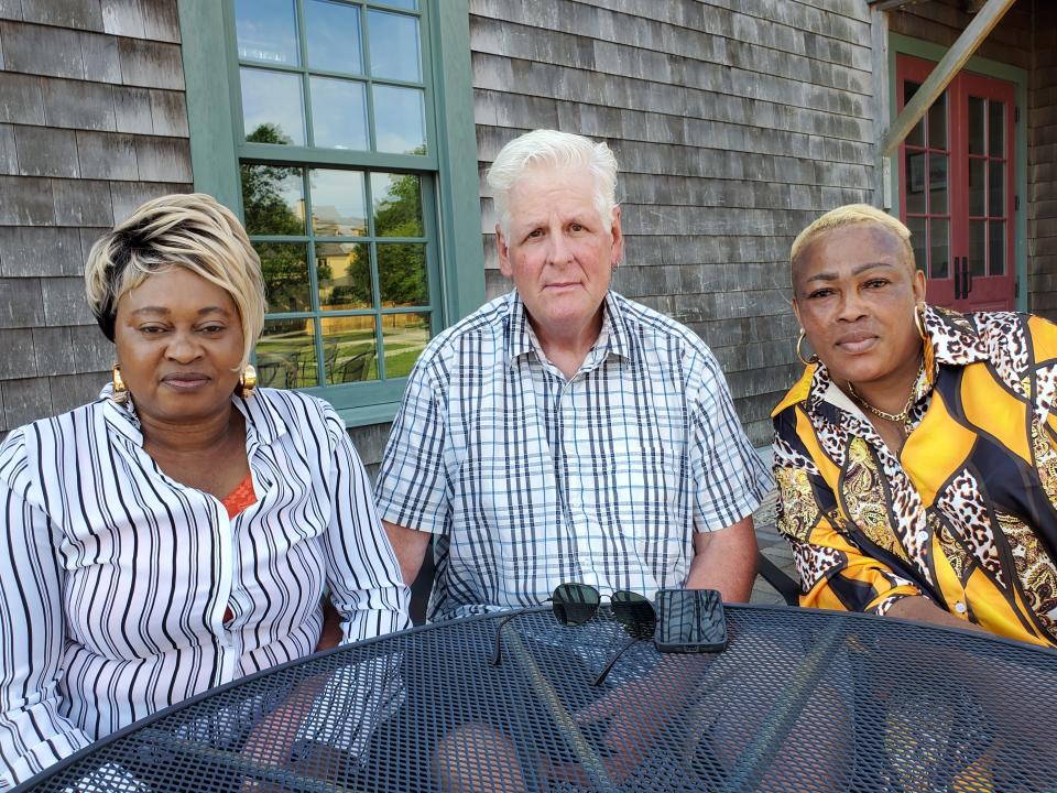 Chantal Ahumbiwa, left, who became a U.S. citizen Monday, July 4, 2022 in a naturalization ceremony brought friends to share her day, Clark Gaskill and Esther Tembela. They are seen at Strawbery Banke Museum in Portsmouth.