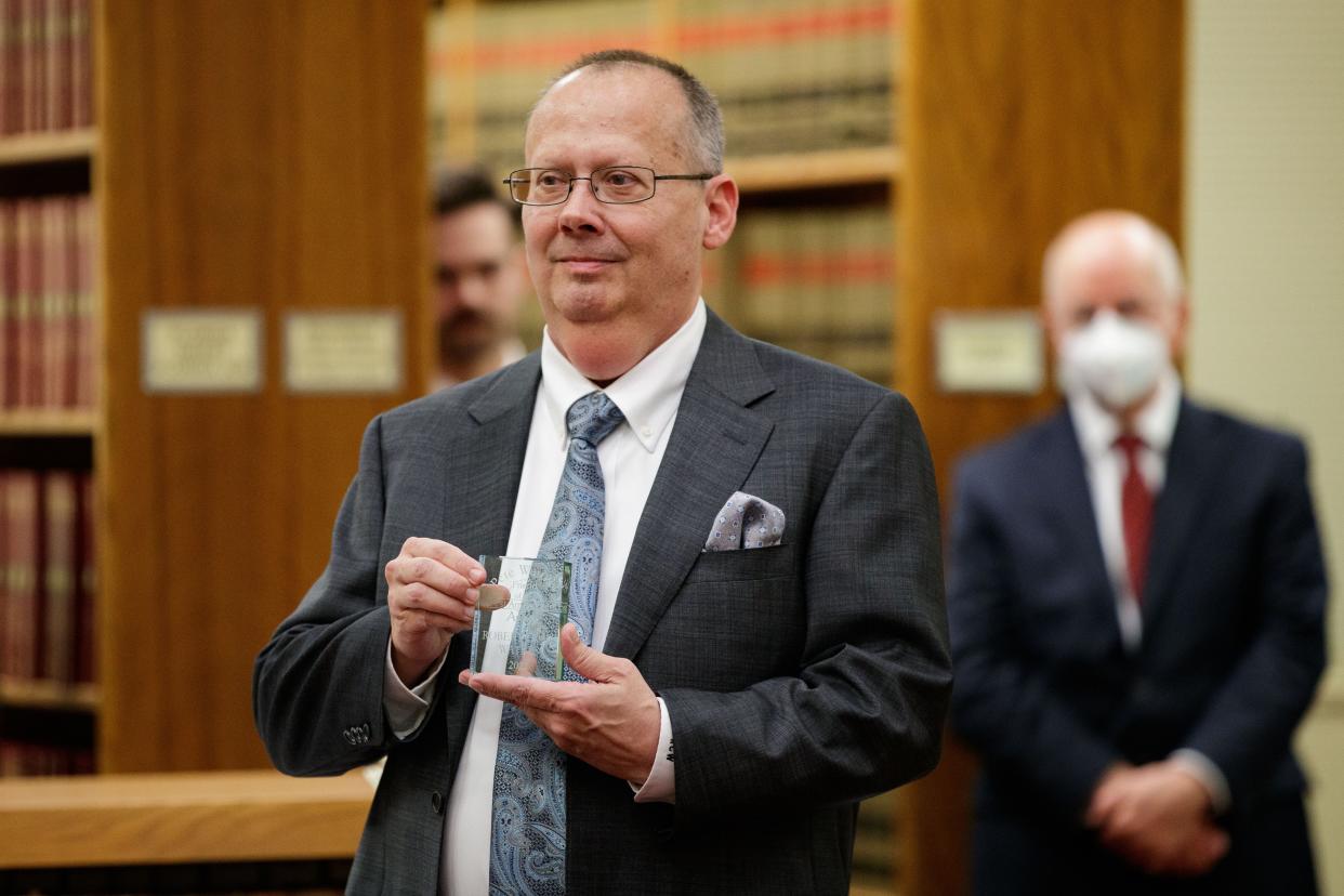 Florida Supreme Court communications director Craig Waters celebrates with friends and family during his retirement party Wednesday, Feb. 9, 2022.