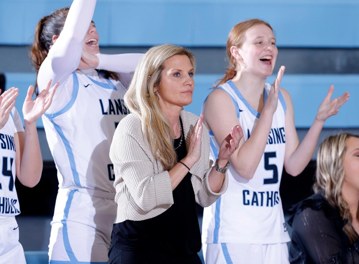 Lansing Catholic coach Kacee Reid watches against Portland, Tuesday, Jan. 9, 2024, in Lansing.