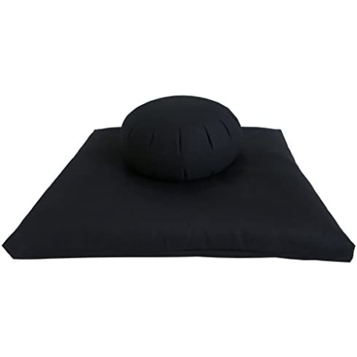 black meditation cushion and mat against a white background