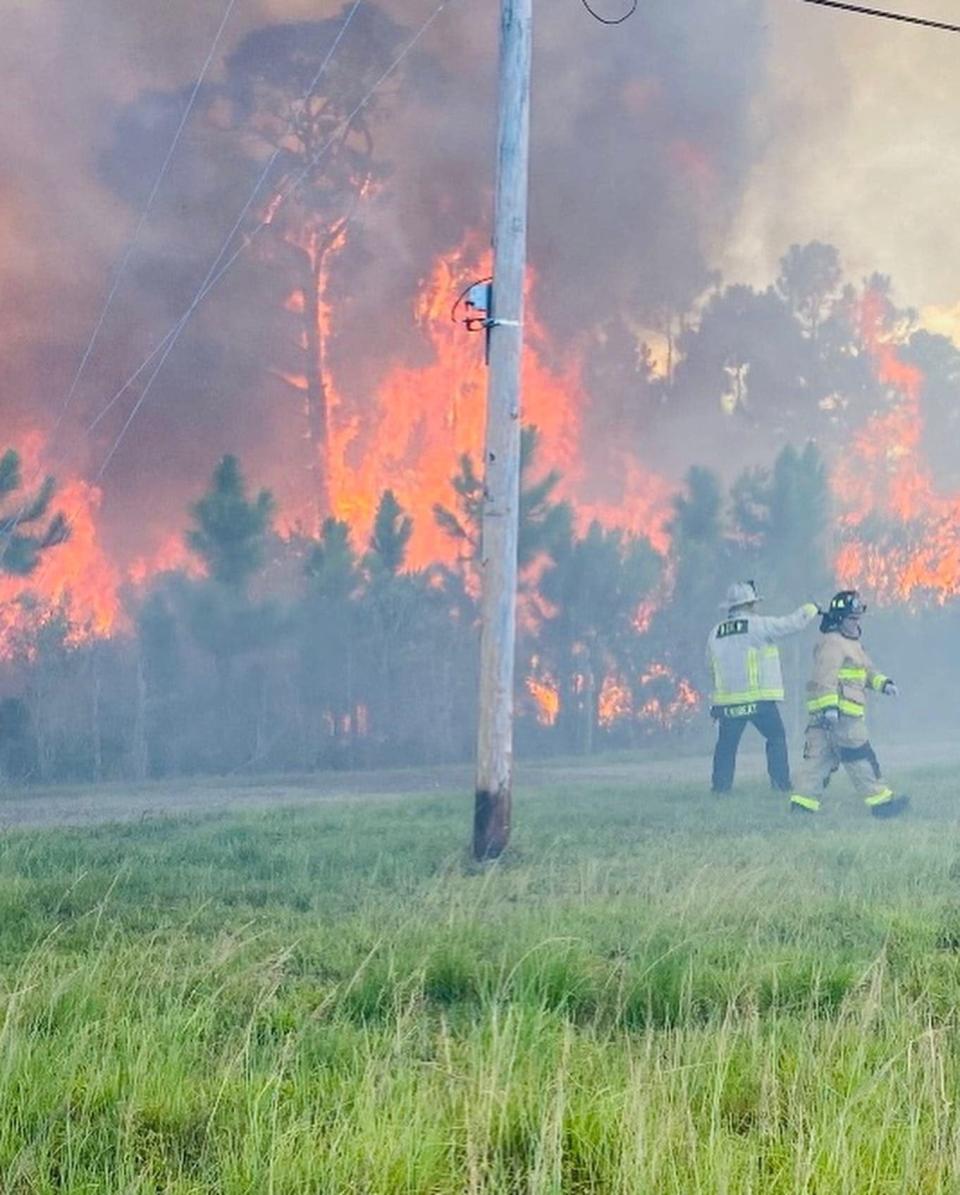 Brevard county Fire Rescue crews battle Micco brushfire on Wednesday.