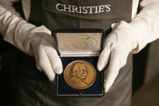A collection of his medals and awards, including honours from the Royal Astronomical Society, sold for �296,750