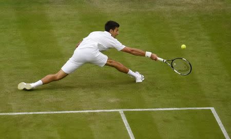 Serbia's Novak Djokovic in action against France's Adrian Mannarino, June 29, 2016. REUTERS/Toby Melville