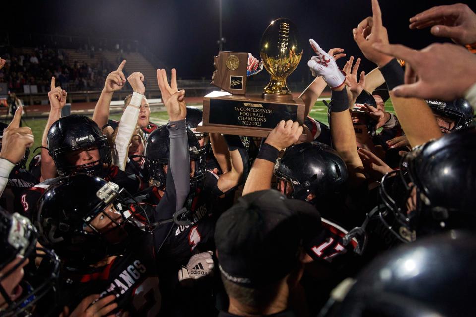 Nov 12, 2022; Scottsdale, az, usa; The Mogollon Mustangs celebrate their 1A state championship after defeating the Williams Vikings at Coronado High School football field.