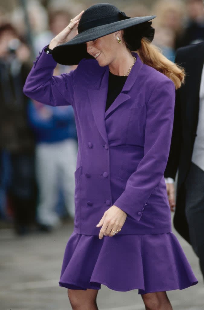 The Duchess of York wearing a purple suit at the wedding of the Marquis of Marlborough and Rebecca Few Brown