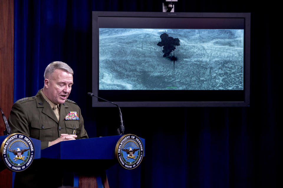 Video of the Abu Bakr al-Baghdadi raid is displayed as U.S. Central Command Commander Marine Gen. Kenneth McKenzie speaks, Wednesday, Oct. 30, 2019, at a joint press briefing at the Pentagon in Washington. (AP Photo/Andrew Harnik)