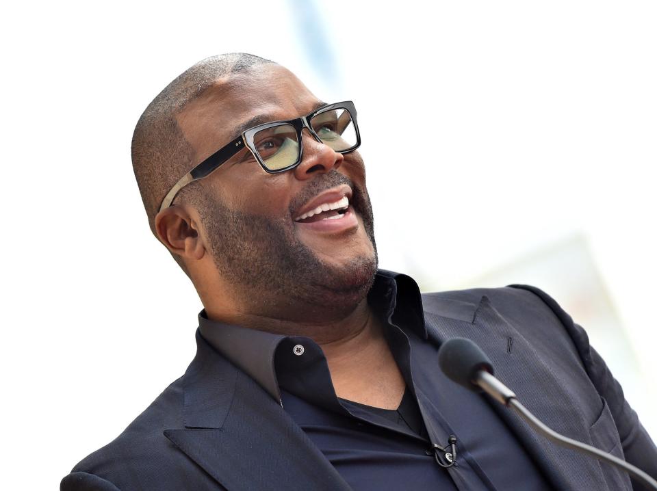 Tyler Perry speaks at an event.