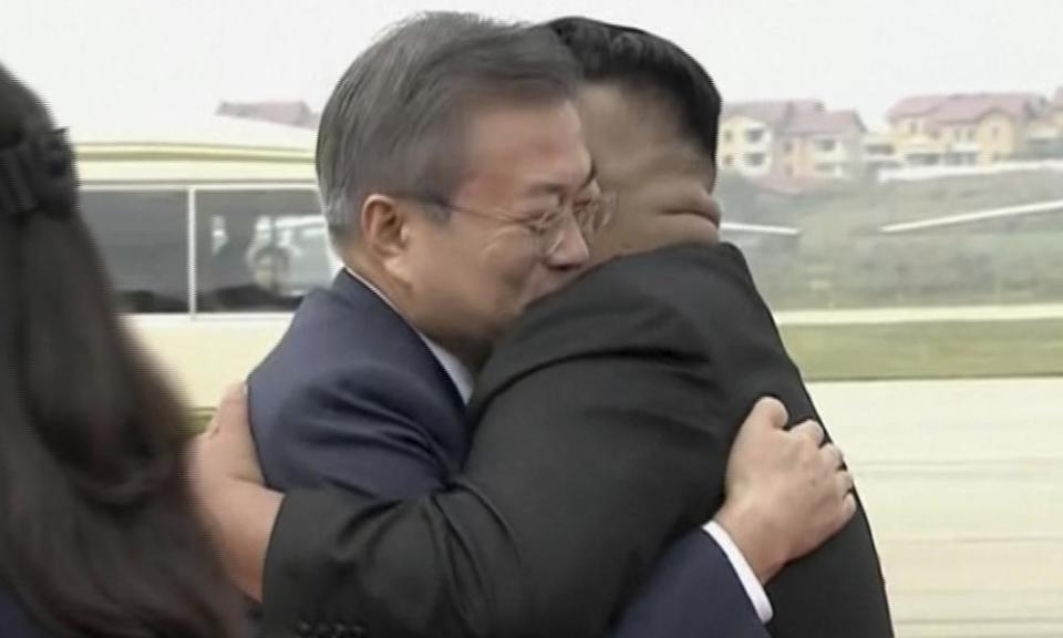 South Korean President Moon Jae-in hugs North Korean leader Kim Jong-Un