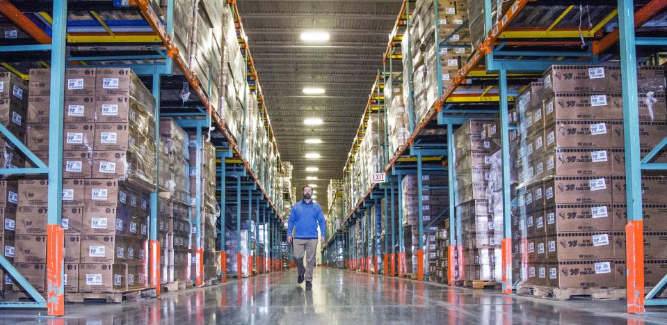 Joy Cone Company general manager Joe Pozar, Jr., walks past millions of ice cream cones at the Joy Cone Company plant in Flagstaff, Wednesday, November 29, 2018.