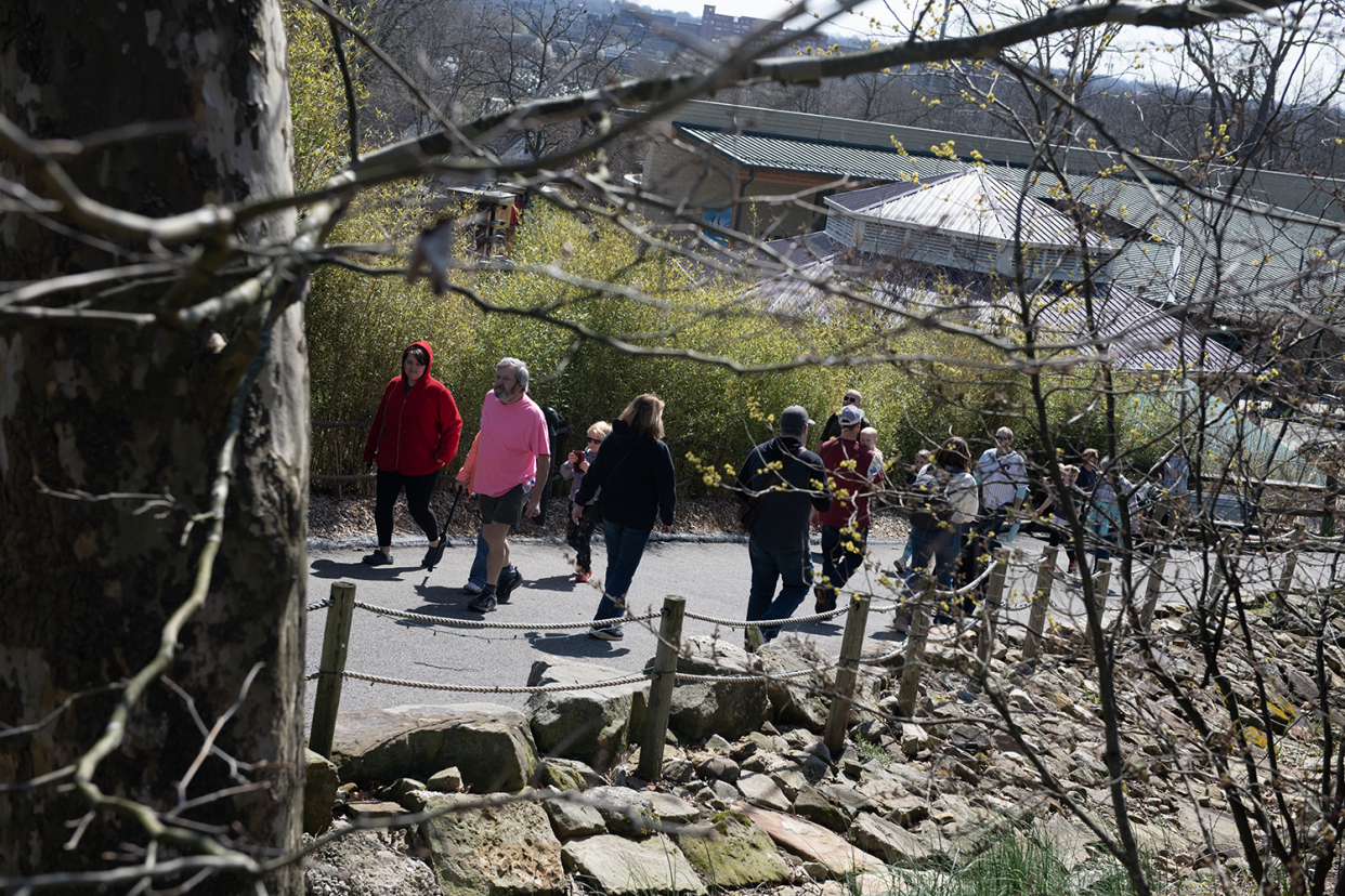 Guests walk the Akron Zoo on Monday, April 8l.