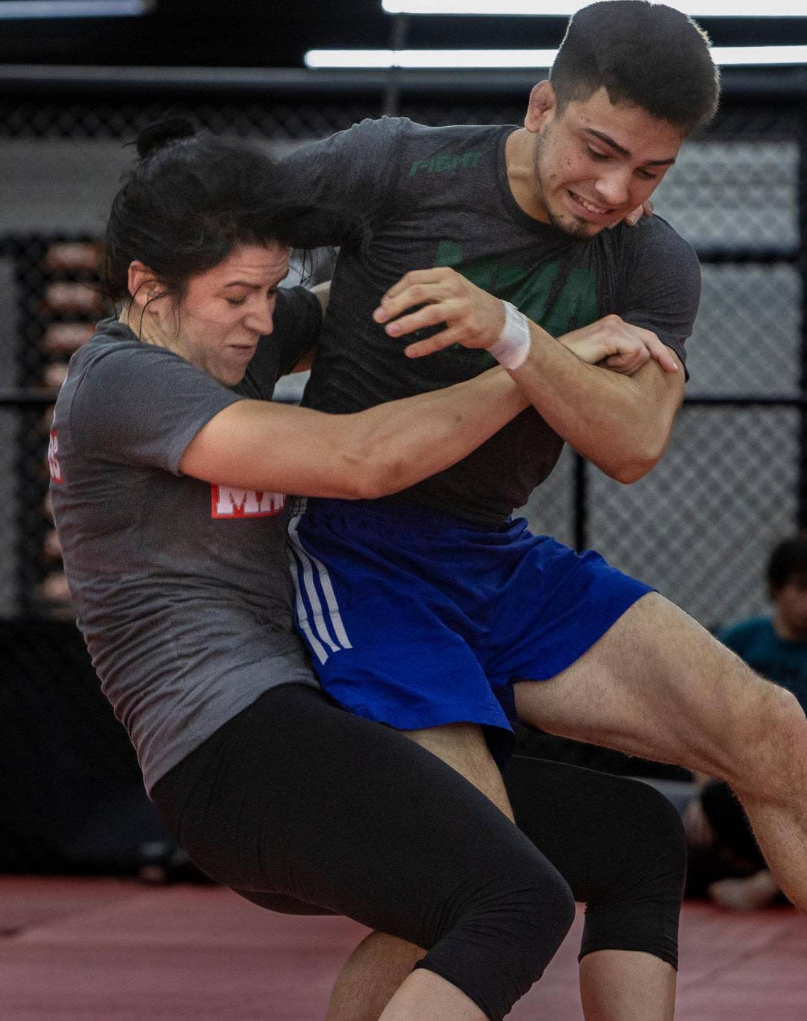 Ana Bozovic, left, grapples with a training partner at the MMA Masters gym in Hialeah.