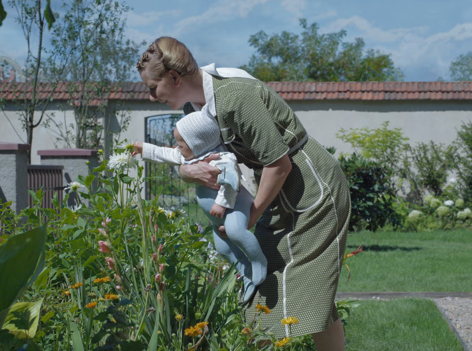 ‘The Zone of Interest’ tells the story of an idyllic home life, and the greatest horror of the 20th century, side by side (A24)