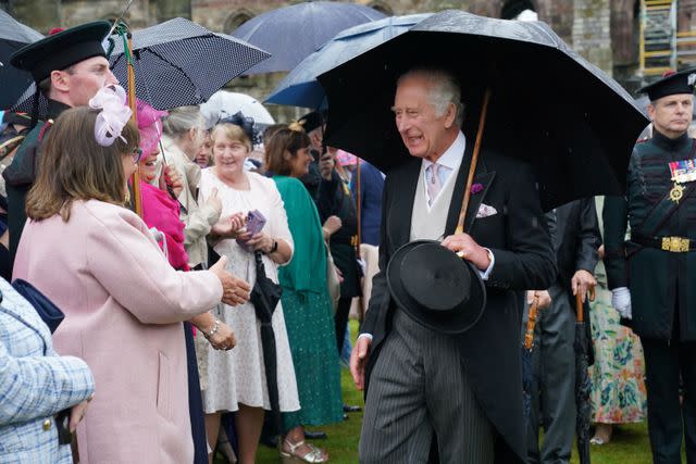 <p>JONATHAN BRADY/POOL/AFP via Getty </p> King Charles at the Garden Party in Edinburgh