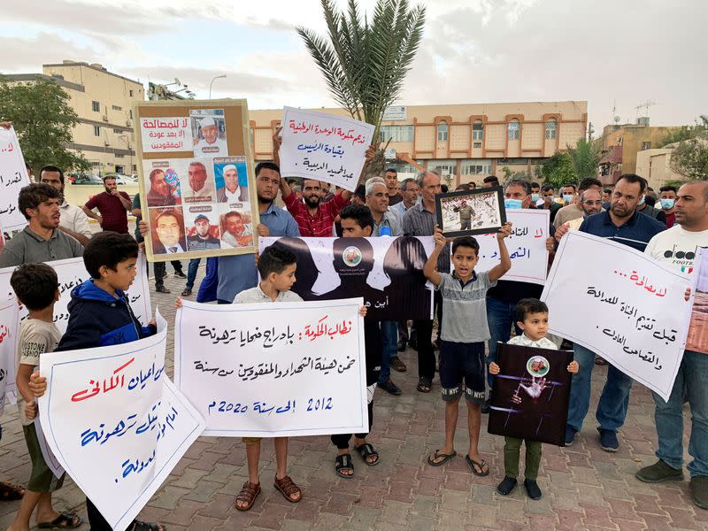 FILE PHOTO: Families of the victims gather during a protest demanding justice for the missing people and mass graves, in Tarhouna