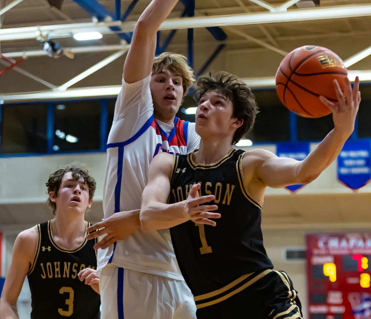 Johnson Jaguars guard Jack Untermeyer (1) drives to the basket as Westlake Chaparrals forward Brody Wilhelm (10) defends during the second period at the District 26-6A boys basketball game on Friday, Jan 5, 2024, at Westlake High School — West Lake Hills, TX.