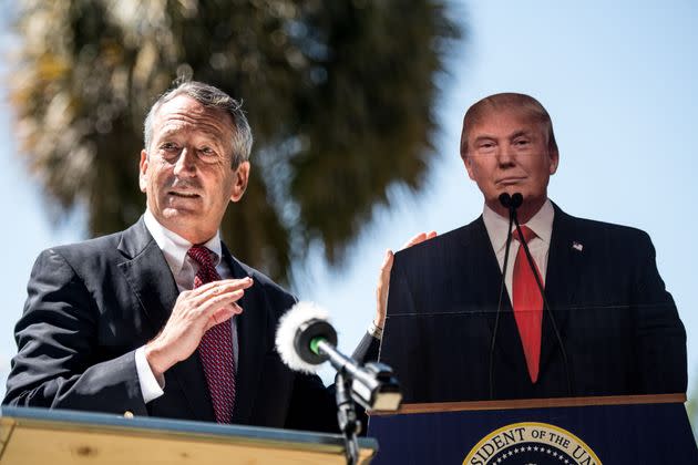 Former Rep. Mark Sanford (R) stands next to a cutout of then-President Donald Trump during a short-lived presidential run in 2019. Sanford embodied the Lowcountry's complex politics. (Photo: Sean Rayford/Getty Images)