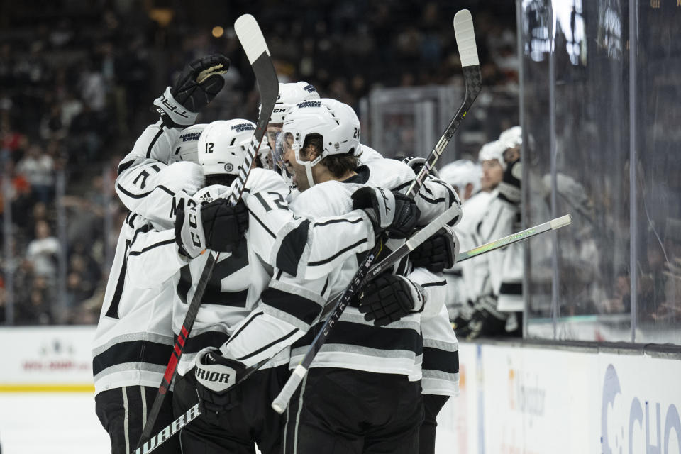 Los Angeles Kings players celebrate after a goal by left wing Kevin Fiala (22) during the second period of an NHL hockey game against the Anaheim Ducks, Friday, Nov. 24, 2023, in Anaheim, Calif. (AP Photo/Kyusung Gong)