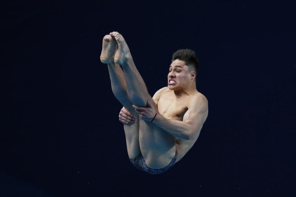 Osmar Olvera Ibarra of Mexico makes a dive during the men's 1m springboard finals at the World Aquatics Championships in Doha, Qatar, Saturday, Feb. 3, 2024. (AP Photo/Hassan Ammar)