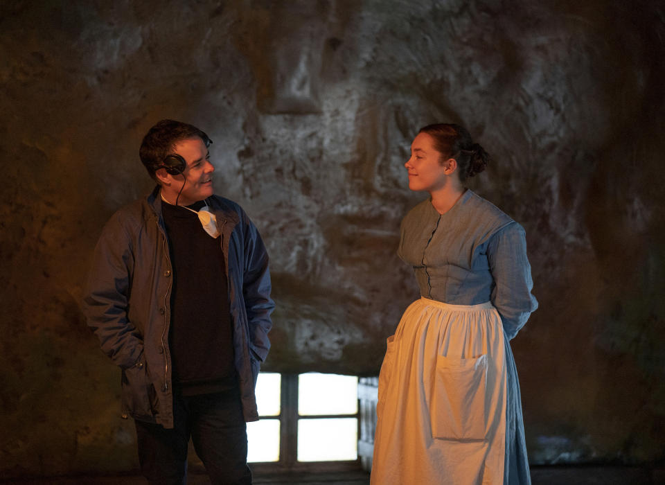 This image released by Netflix shows writer-director Sebastián Lelio, left, and Florence Pugh on the set of "The Wonder." (Aidan Monaghan/Netflix via AP)