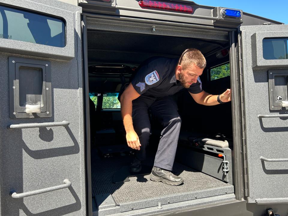 Sgt. Joe Garrison with the Beech Grove Police Department climbs out of the back of a BearCat. Aug. 31, 2023