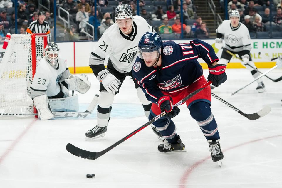 Dec 5, 2023; Columbus, Ohio, USA; Columbus Blue Jackets right wing Justin Danforth (17) chases down a puck in front of Los Angeles Kings defenseman Jordan Spence (21) during the third period of the NHL game at Nationwide Arena. The Blue Jackets lost 4-3 in overtime.