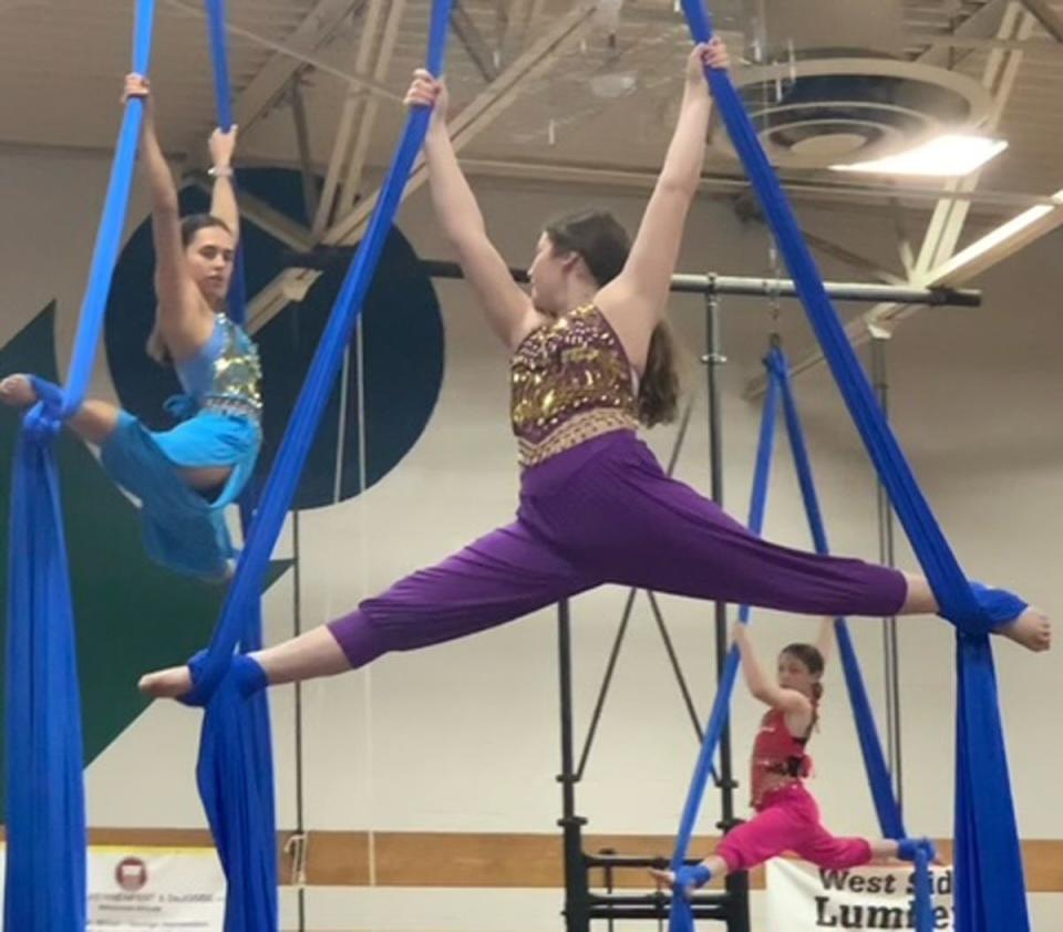 Performers hang from aerial silks during a rehearsal for the upcoming YMCA spring circus event to be held May 14 & 15. This year's theme is inspired by Disney's Aladin.