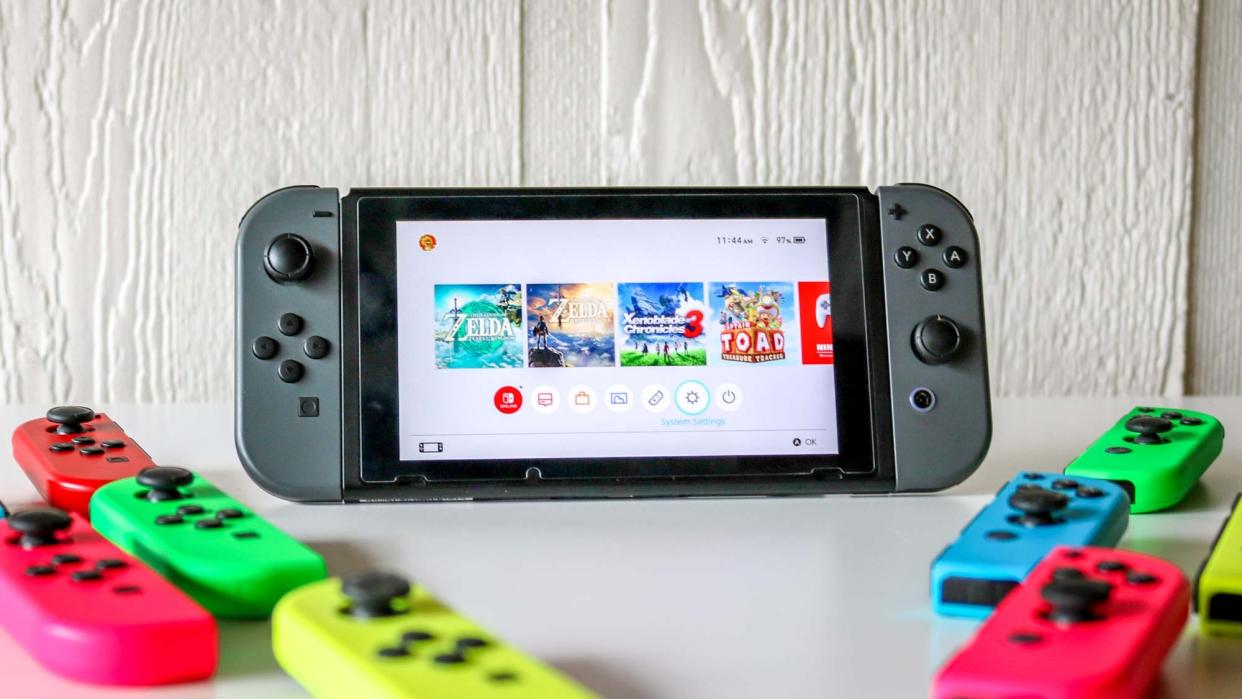  The Nintendo Switch next to a bunch of Joy-Cons 