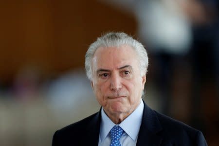 Brazil's President Michel Temer reacts during breakfast with journalists at the Alvorada Palace in Brasilia, Brazil December 22, 2017. REUTERS/Adriano Machado