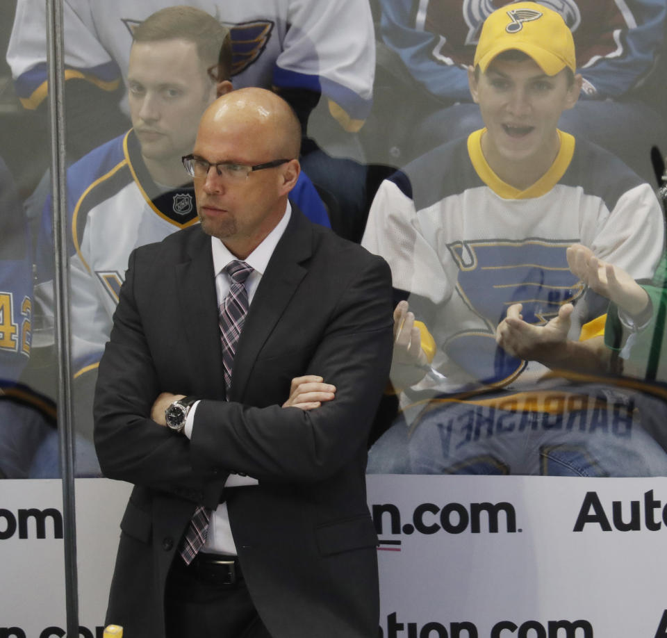 FILE - In this March 31, 2017, file photo, St. Louis Blues head coach Mike Yeo looks on in the first period of an NHL hockey game against the Colorado Avalanche, in Denver. Here comes Minnesota's first-round opponent, none other than the surging St. Louis team coached by former Wild bench boss Mike Yeo. (AP Photo/David Zalubowski, File)