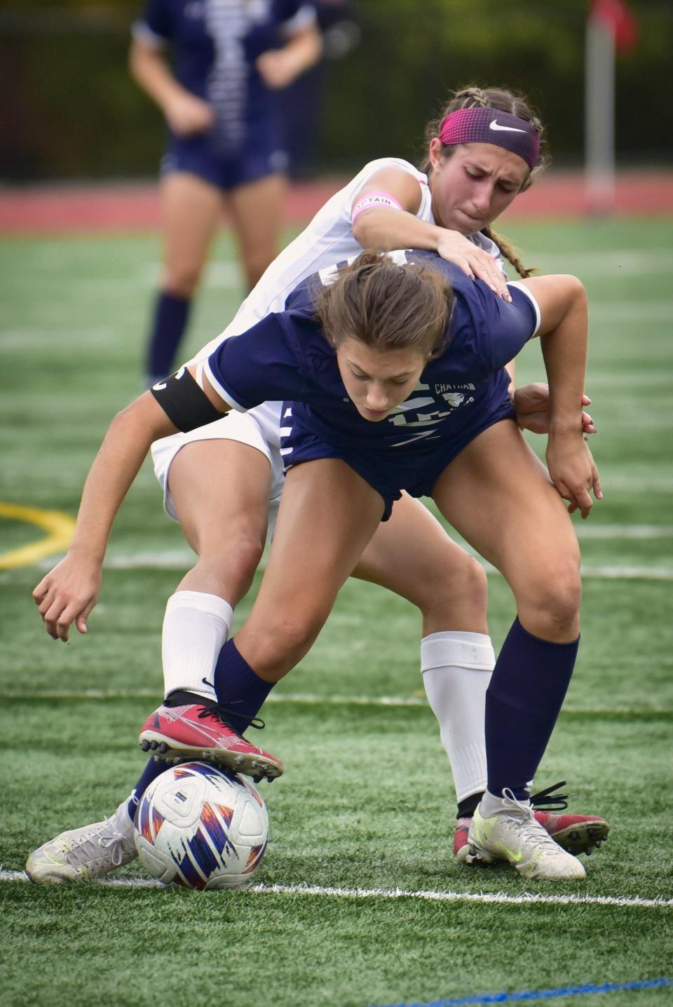 Paige Droner, #10 of Chatham controls the ball as Olivia Russomanno, # 11 of Cranford tries to steal from the behind in the second half during the NJSIAA North 2, Group 3 Girls Soccer Semifinal at Cougar Field in Chatham, Tuesday 11/01/22.