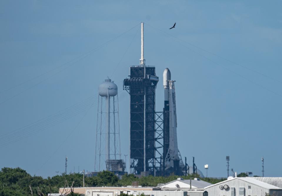 A SpaceX Falcon 9 rocket stands at Kennedy Space Center's pad 39A with the 28th batch of Starlink internet satellites on Saturday, May 15, 2021.