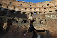 <p>Tennis player Maria Sharapova of Russia jumps in the air to strike a pose inside the Colosseum in Rome, May 14, 2017 (Photo: Michael Steele/Getty Images) </p>