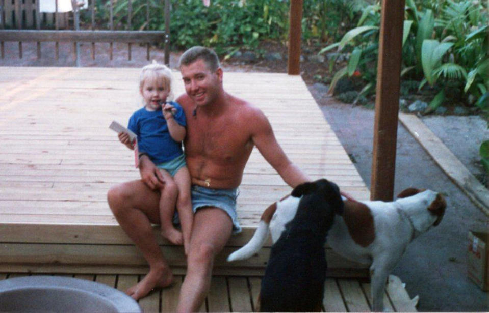 Murdered Queensland woman Toya Cordingley is pictured as a little girl, sitting on her dad Troy's lap.