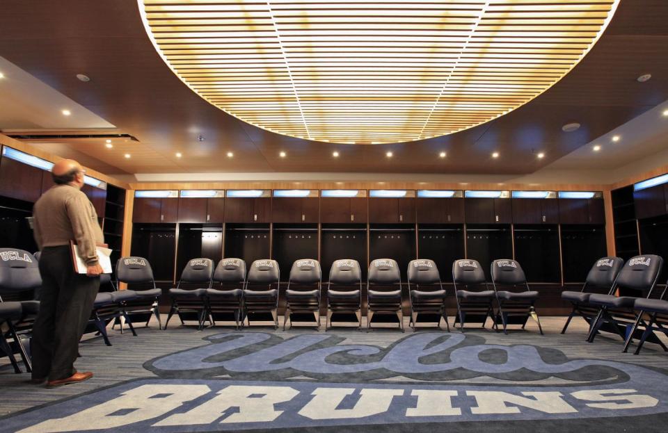 In this photo taken Tuesday, Oct. 23, 2012, the newly renovated locker room's meeting area at Pauley Pavilion is shown at UCLA in Los Angeles. The UCLA Bruins honor their championship past and address the future in the $132 million renovation to be unveiled on Nov. 9 when they host Indiana State in their men’s basketball season opener. (AP Photo/Damian Dovarganes)