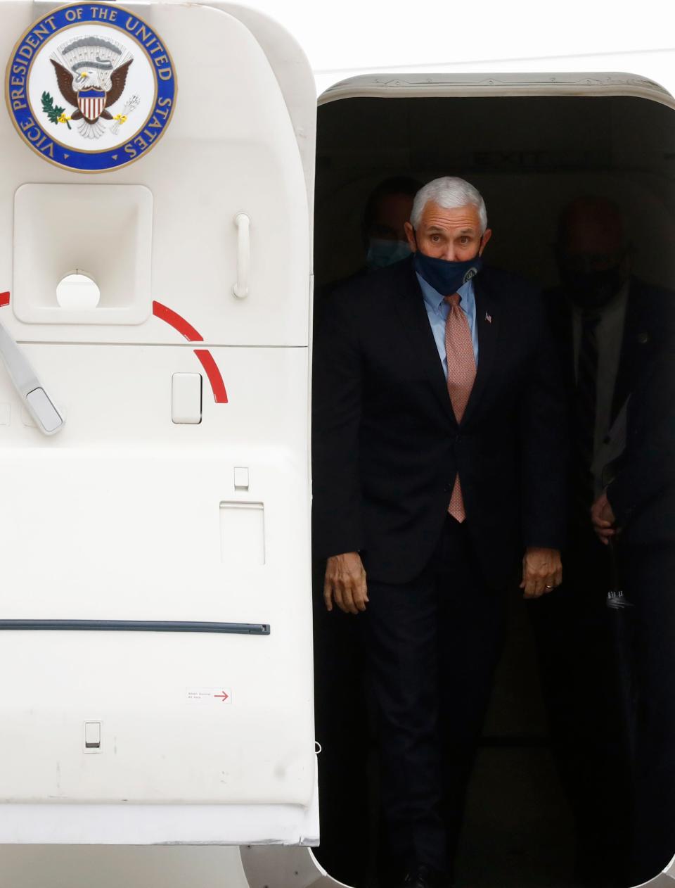 Vice President Mike Pence prepares to exit Air Force Two at the Air National Guard 164th Airlift Wing for a rountable discussion about Operation Warp Speed on Thursday, Dec. 3, 2020, in Memphis, Tenn.