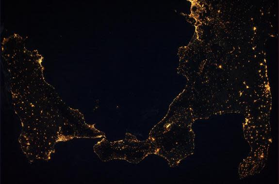 European astronaut Alexander Gerst uploaded this photo of two volcanoes, Mount Etna and Mount Stromboli, by night on Aug. 1, 2014.