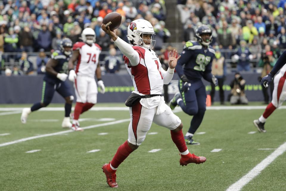 In this Dec. 22, 2019, photo, Arizona Cardinals quarterback Kyler Murray passes against the Seattle Seahawks during the first half of an NFL football game in Seattle. Murray's impressive first season is early proof that the Arizona Cardinals made a good decision when they selected the quarterback with the No. 1 overall pick in April. (AP Photo/Elaine Thompson)