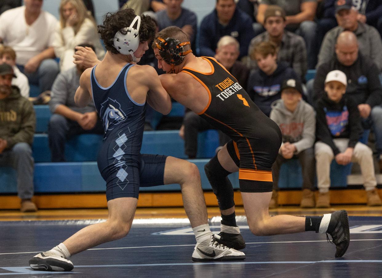 CBA freshman Paul Kenny (left) is shown during his bout with Middletown North's Brady Klinsky Thursday night.
