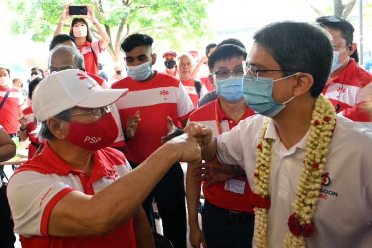 Fist bumps have replaced handshakes on the campaign trail as Singapore prepares for a general election, even as it recovers from a major coronavirus outbreak