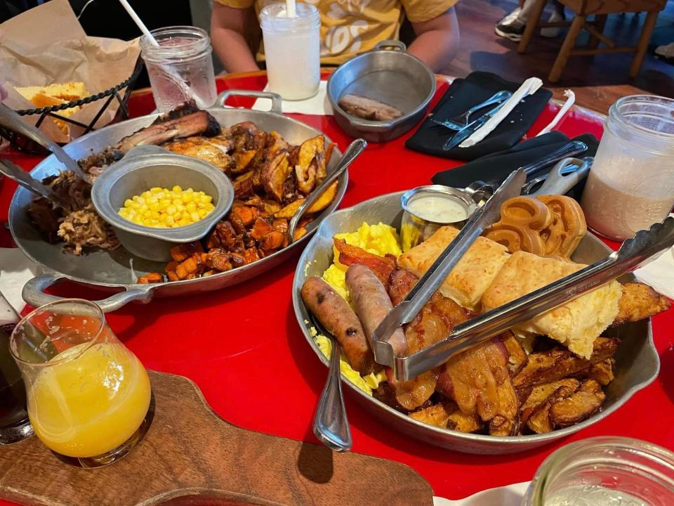 plates of family style breakfast from whispering canyon cafe at disney's wilderness lodge