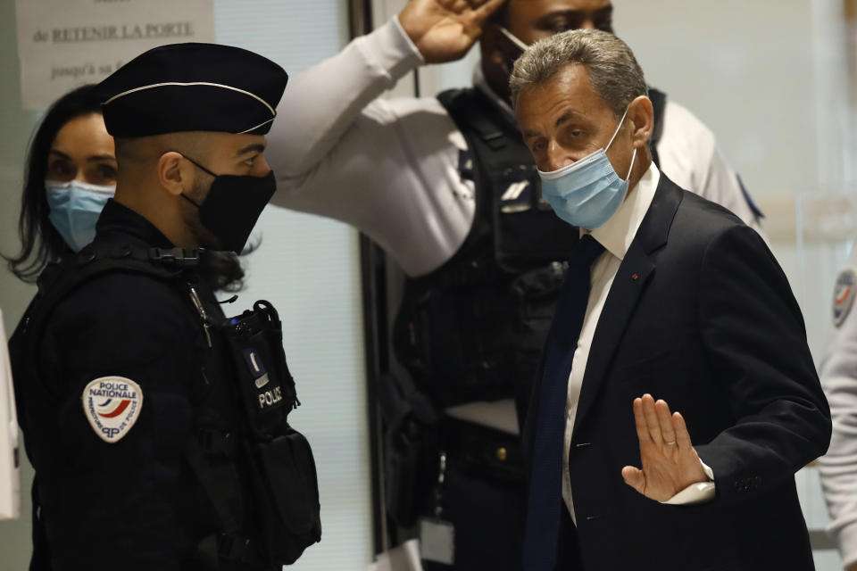 FILE - In this March 1, 2021 file photo, former French President Nicolas Sarkozy arrives at the courtroom in Paris. Former French President Nicolas Sarkozy was found guilty Thursday of illegal campaign financing of his unsuccessful 2012 reelection bid. (AP Photo/Michel Euler, File)
