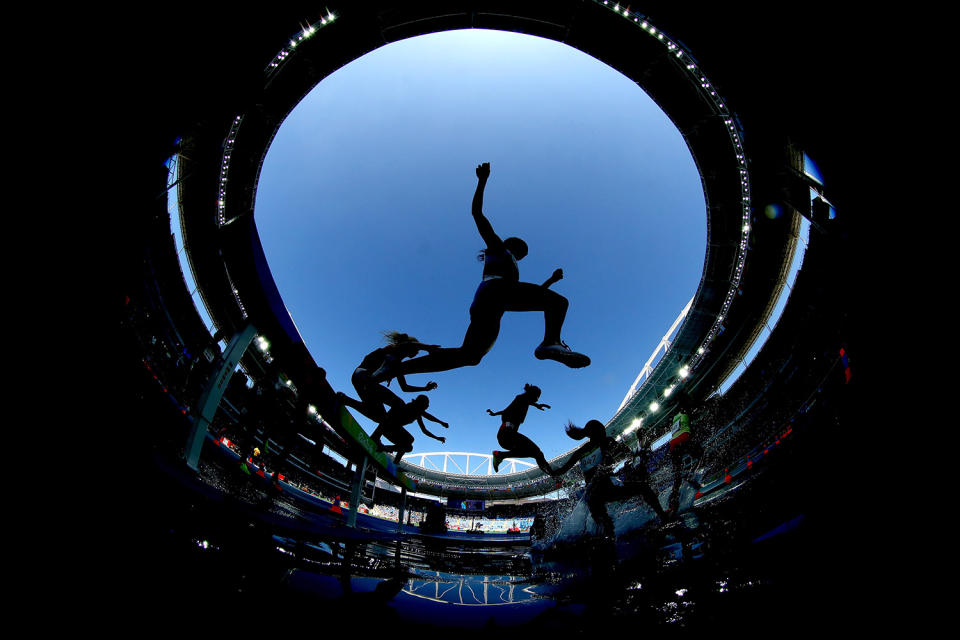 <p>Athletes clear the water jump in the Women’s 3000m Steeplechase Round 1 on Day 8 of the Rio 2016 Olympic Games at the Olympic Stadium on August 13, 2016 in Rio de Janeiro, Brazil. (Photo by Alexander Hassenstein/Getty Images) </p>